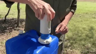 Jugfellow Adaptive Kit used as a dispenser and flexible camp faucet with a common camp water container